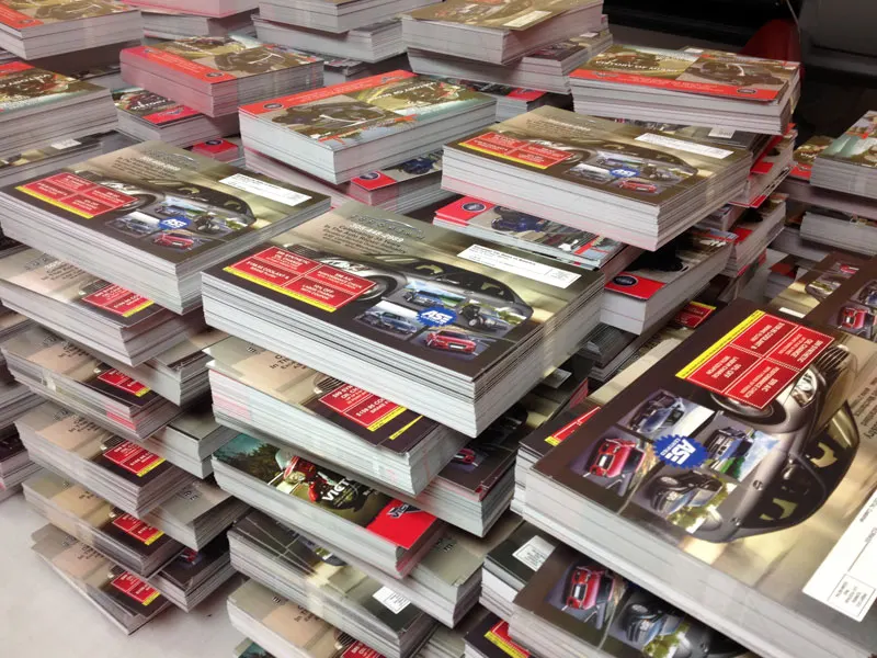 Stacks of printed postcards ready to mail